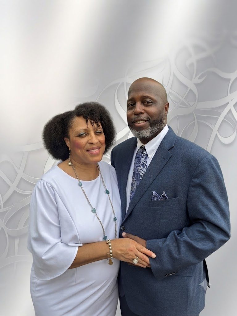 Pastor Chapman and his wife smiling together